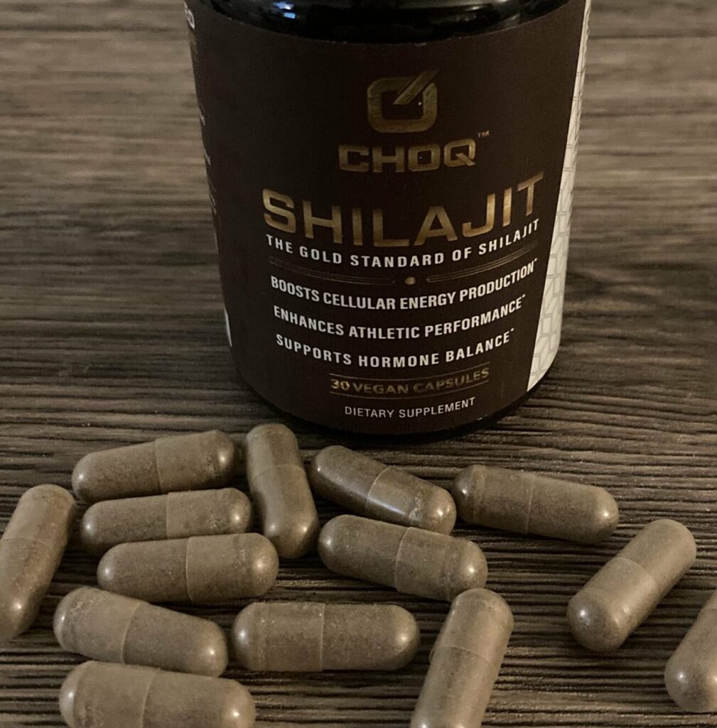 Choq shilajit bottle with capsules around it
